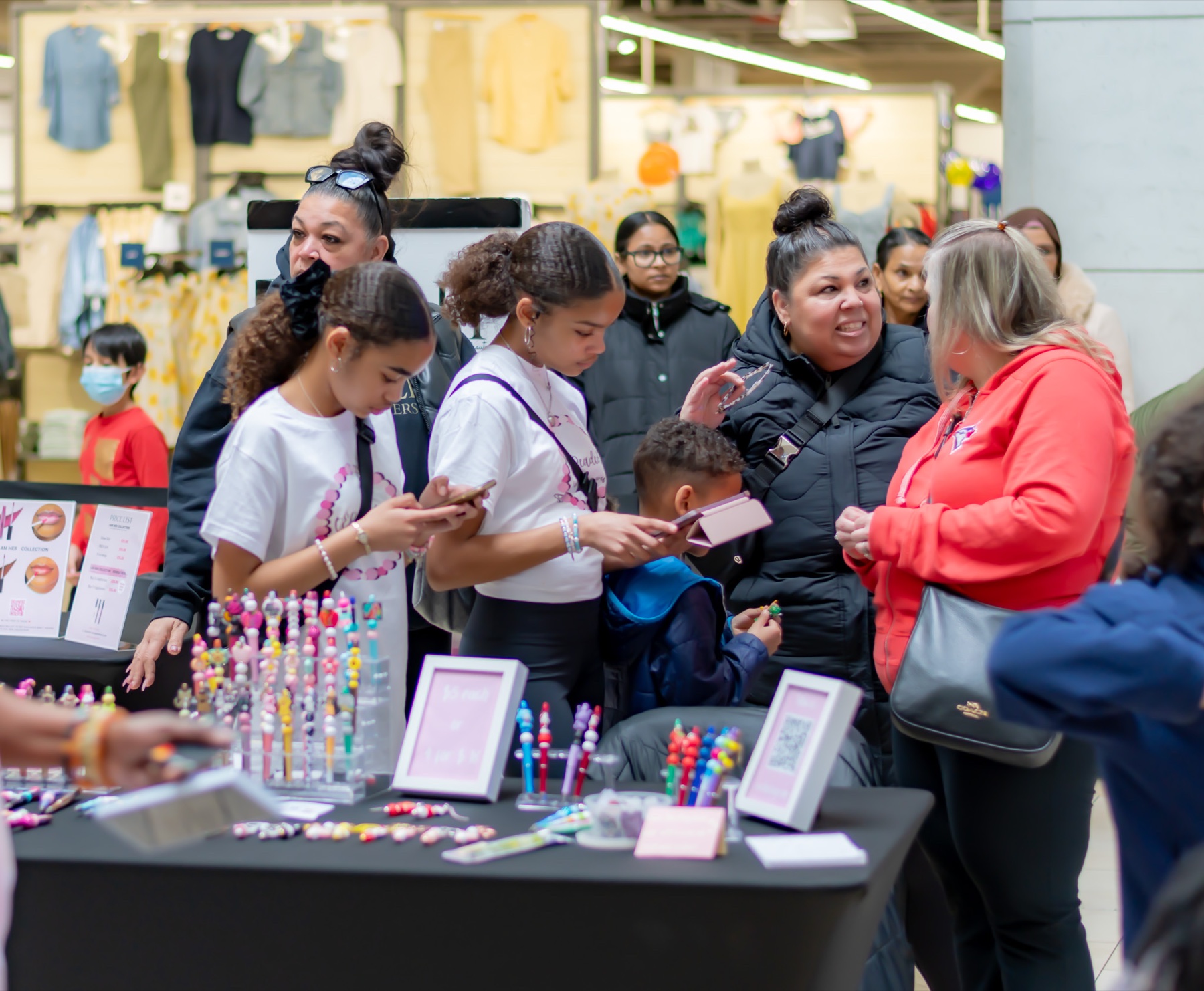 Young Bosses in Business participants presenting and selling products at a youth market